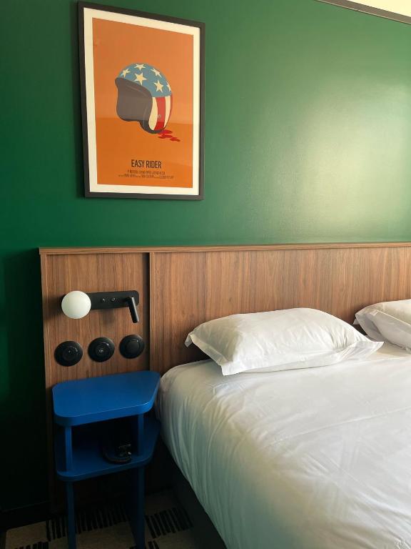 Postel nebo postele na pokoji v ubytování Hotel Le Lumière