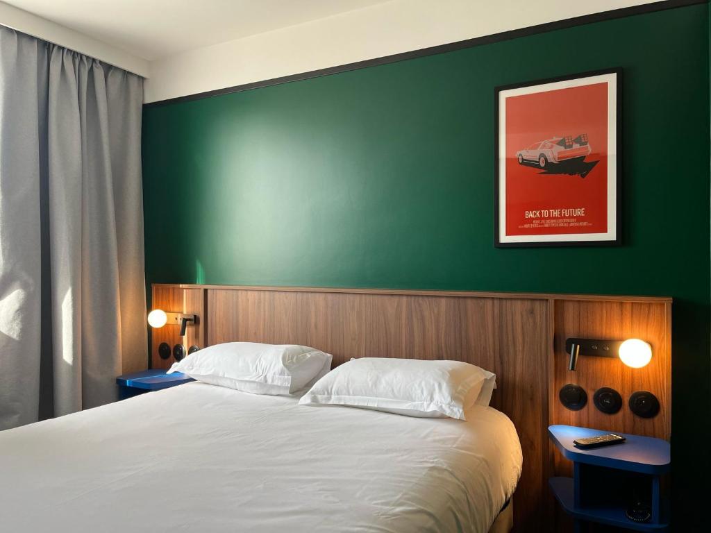 Postel nebo postele na pokoji v ubytování Hotel Le Lumière