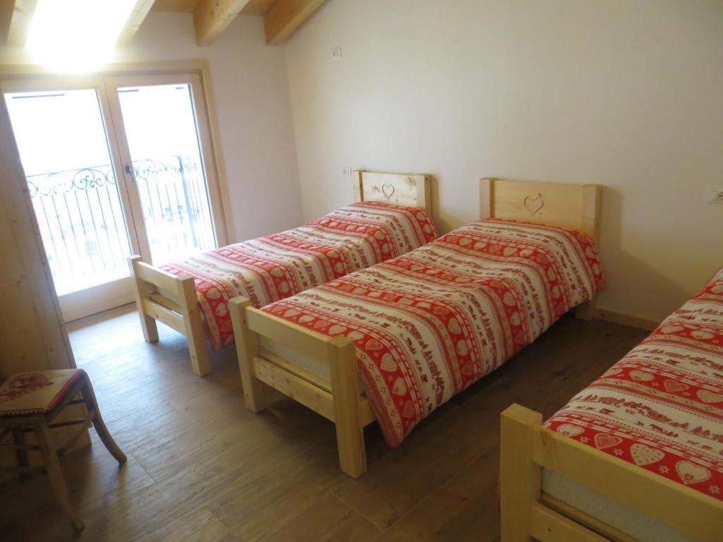 A bed or beds in a room at Olimpic Hostel