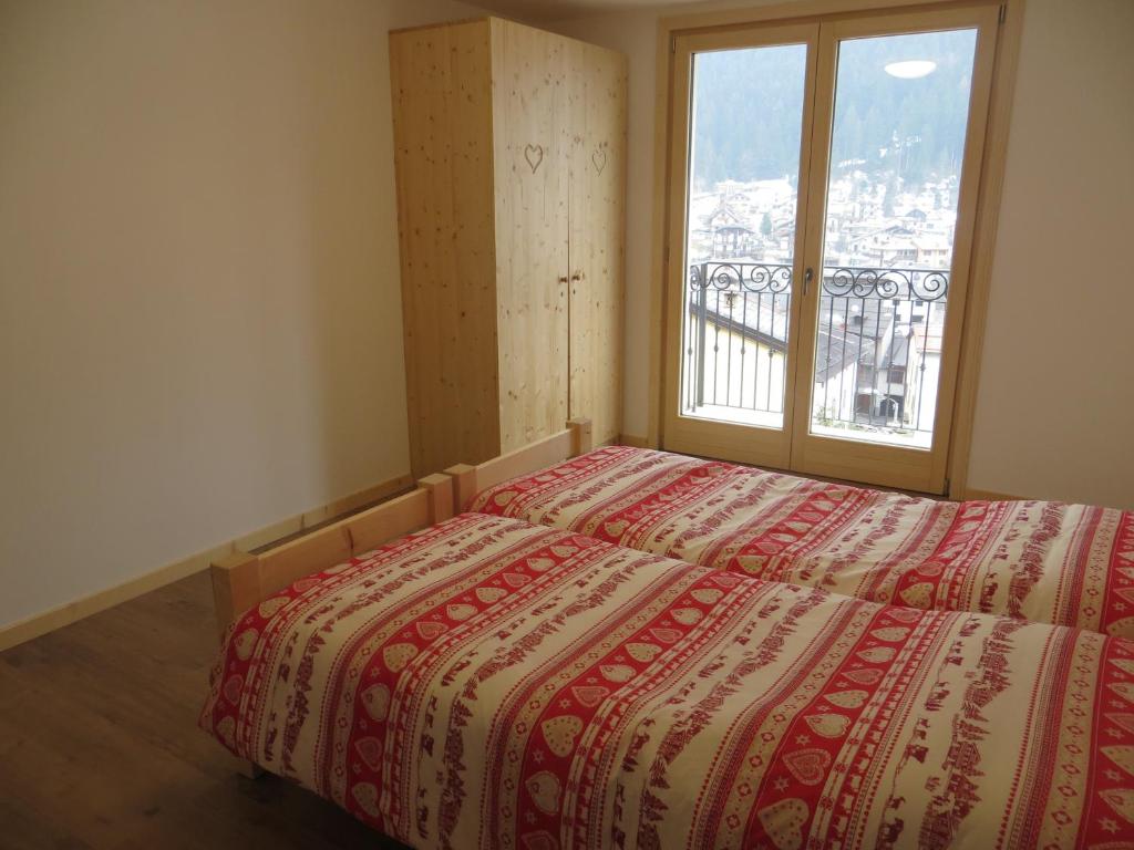 A bed or beds in a room at Olimpic Hostel