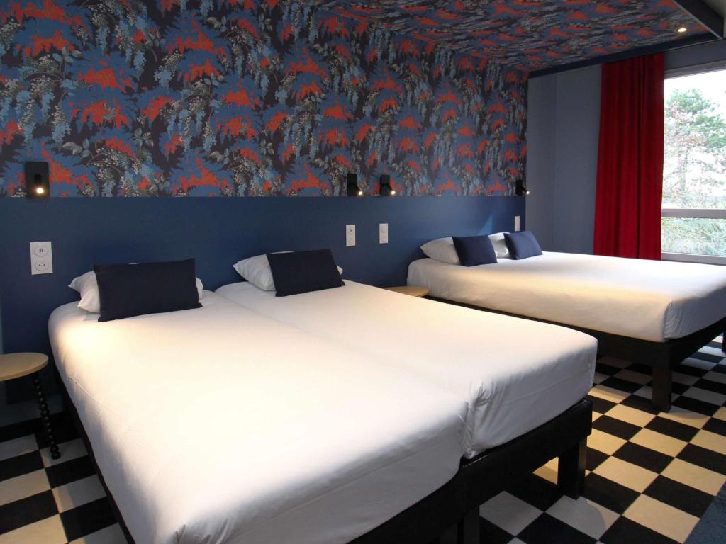 Postel nebo postele na pokoji v ubytování ibis Styles Dijon Sud Domaine De Beauregard 21600 Longvic