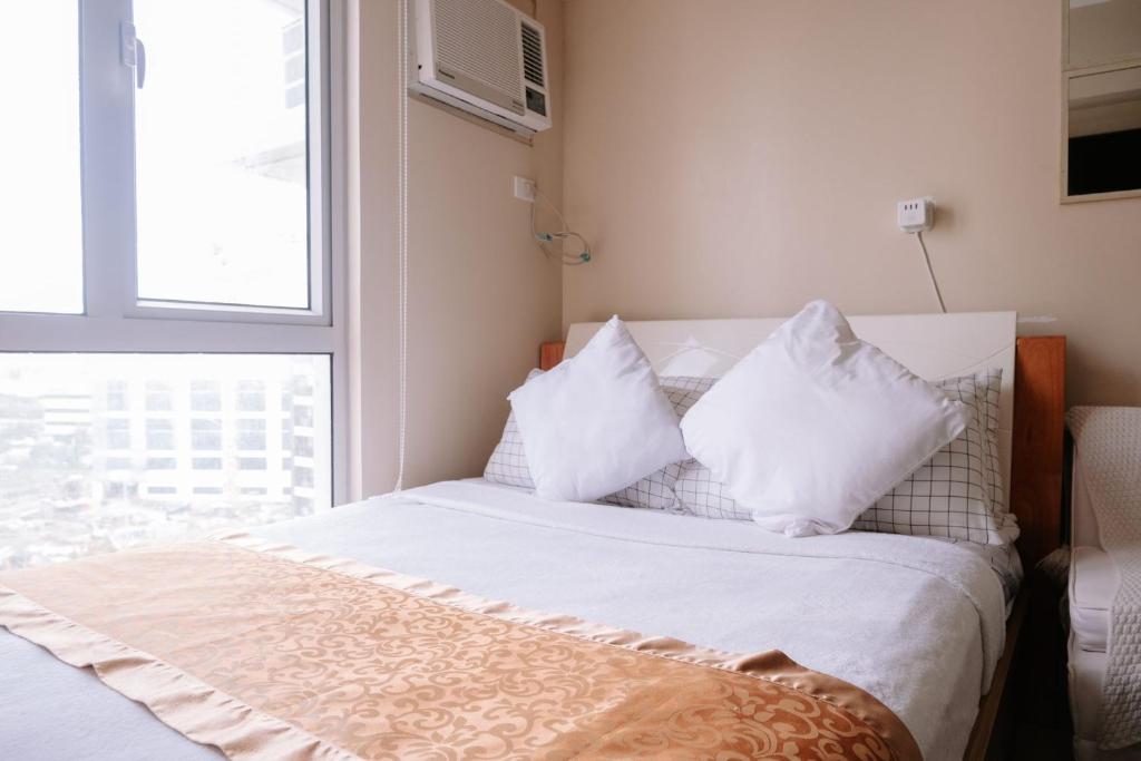 En eller flere senge i et værelse på Find Your Zen in the City