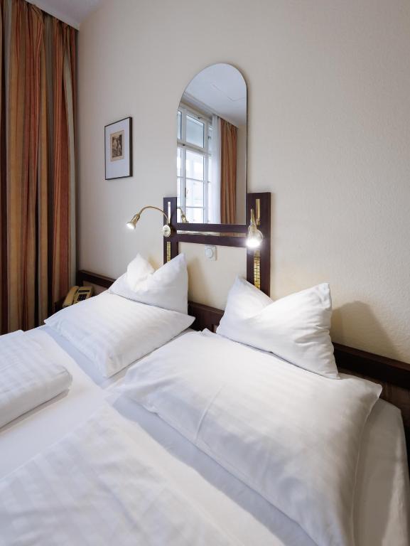 Postelja oz. postelje v sobi nastanitve Continental Hotel-Pension