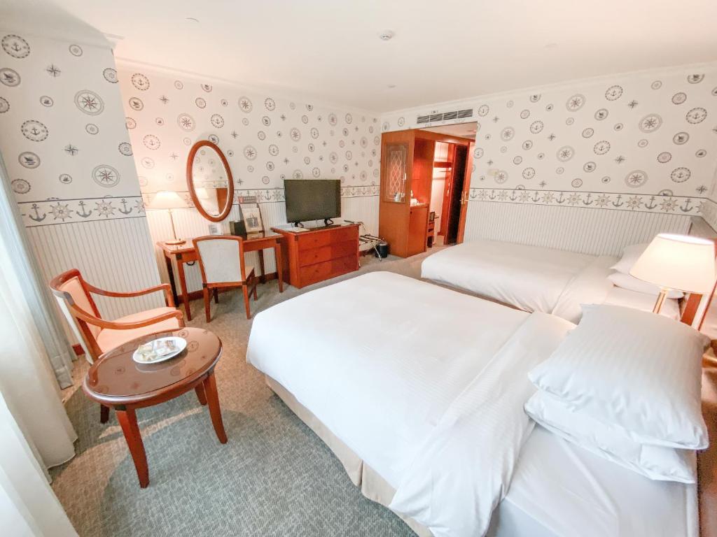 Voodi või voodid majutusasutuse Evergreen Laurel Hotel - Keelung toas