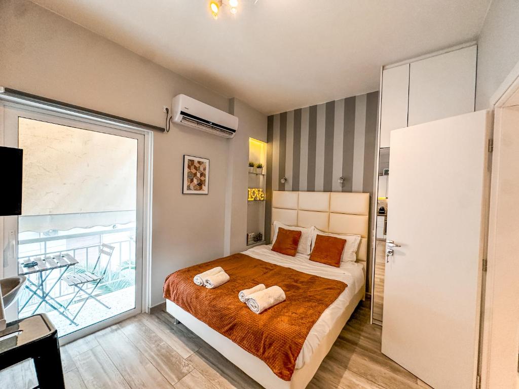 Posteľ alebo postele v izbe v ubytovaní Walk to Markets from a Cozy Studio by Cielo Homes