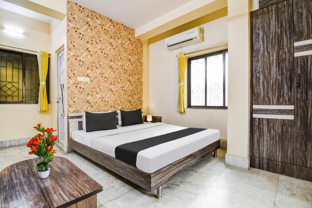 Postel nebo postele na pokoji v ubytování Hotel O Tagore Park