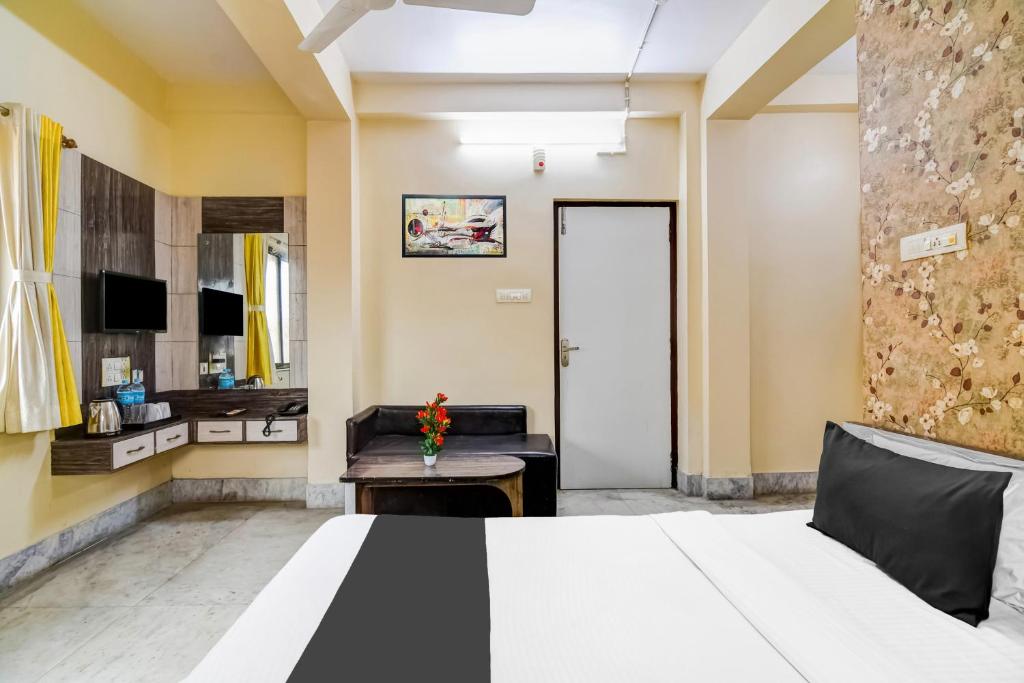 Postel nebo postele na pokoji v ubytování Hotel O Tagore Park