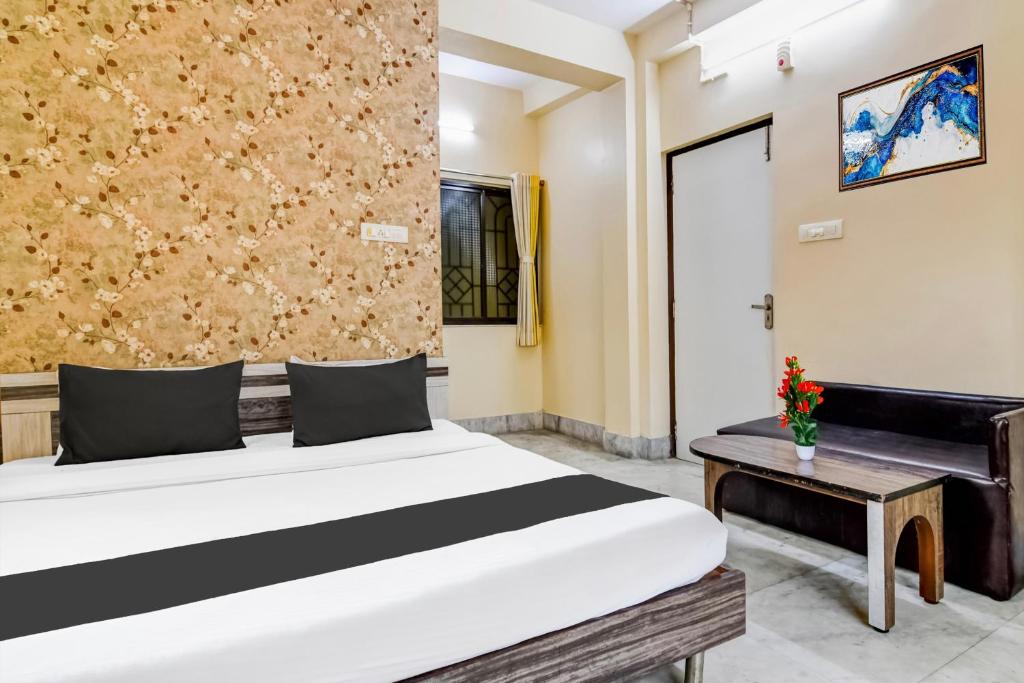 Postel nebo postele na pokoji v ubytování Hotel O Tagore Park