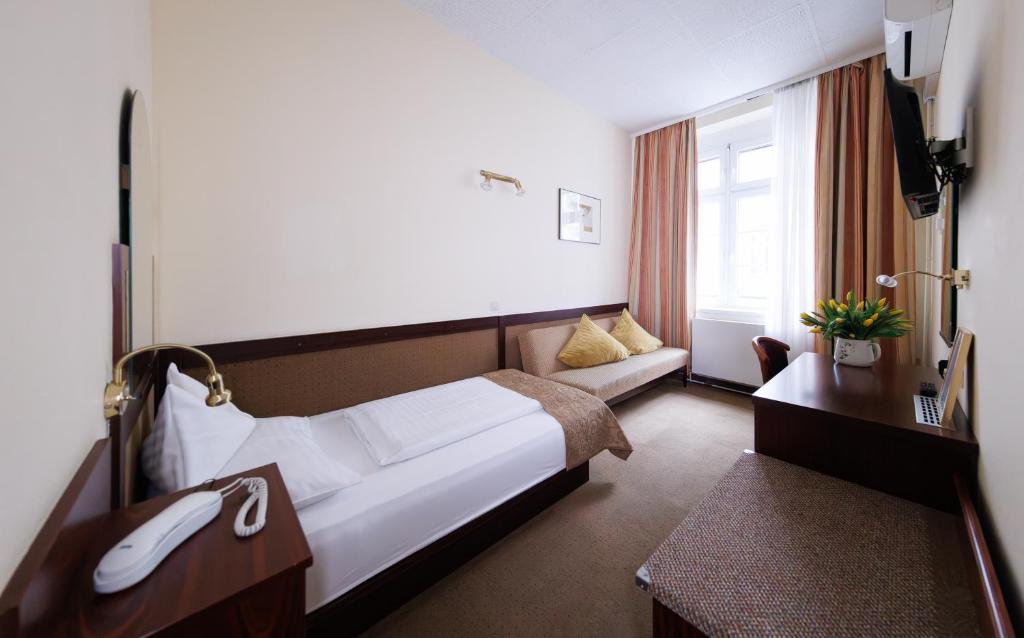 Postelja oz. postelje v sobi nastanitve Continental Hotel-Pension