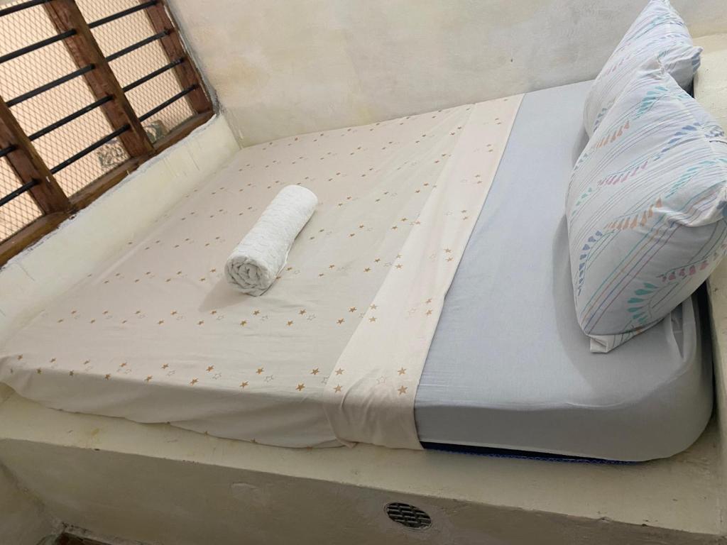 Postel nebo postele na pokoji v ubytování Jacaranda road bnb