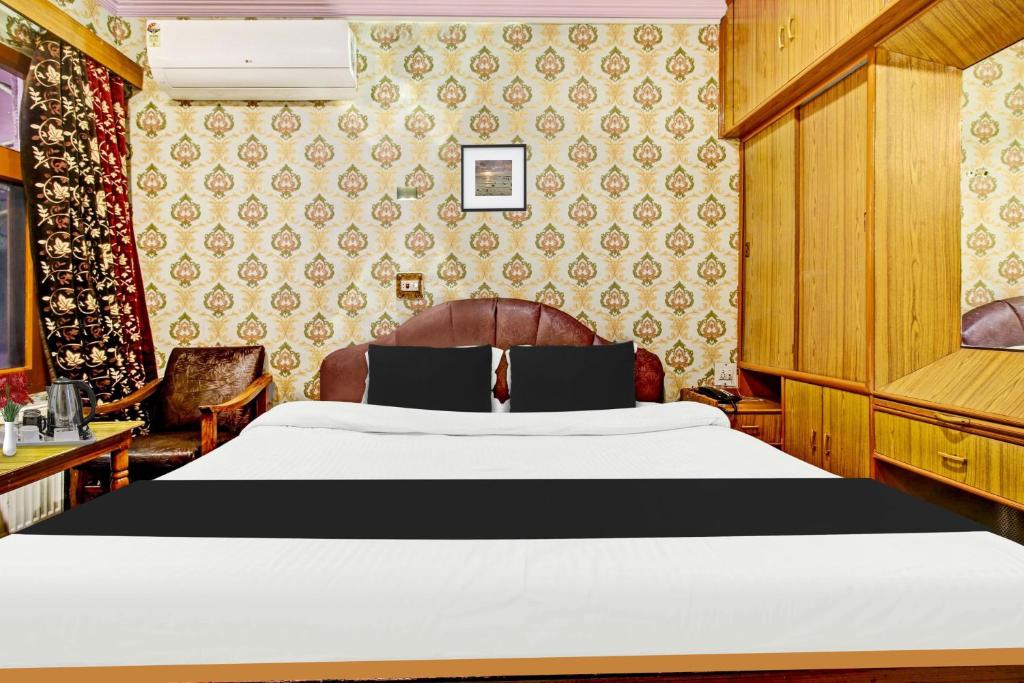 Postel nebo postele na pokoji v ubytování Hotel O Residency Road Srinagar