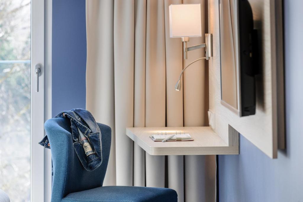 TV a/nebo společenská místnost v ubytování Ibis Styles Konstanz