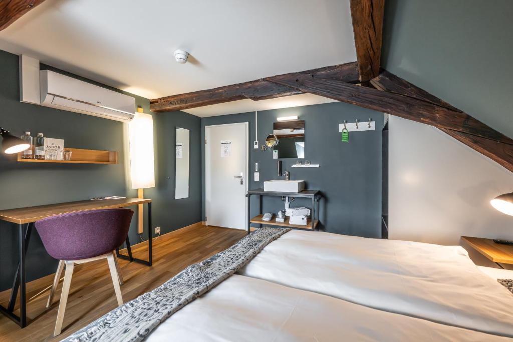 Postel nebo postele na pokoji v ubytování Hotel Jakob