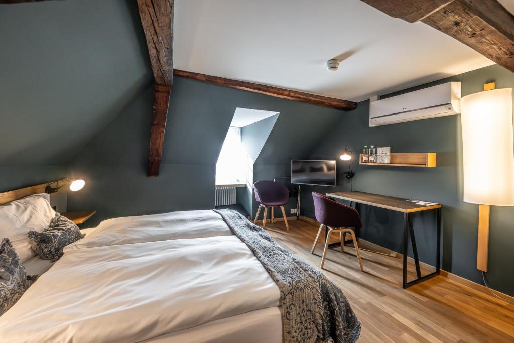 Postel nebo postele na pokoji v ubytování Hotel Jakob