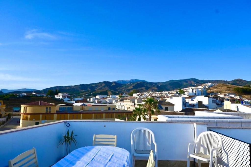 a balcony with a view of a city at Casa Mimi By Solymar Holiday in Vélez-Málaga