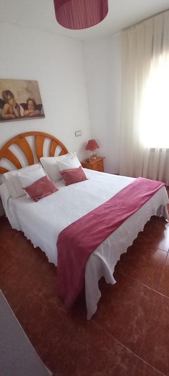 Postel nebo postele na pokoji v ubytování Hostal Las Cadenas