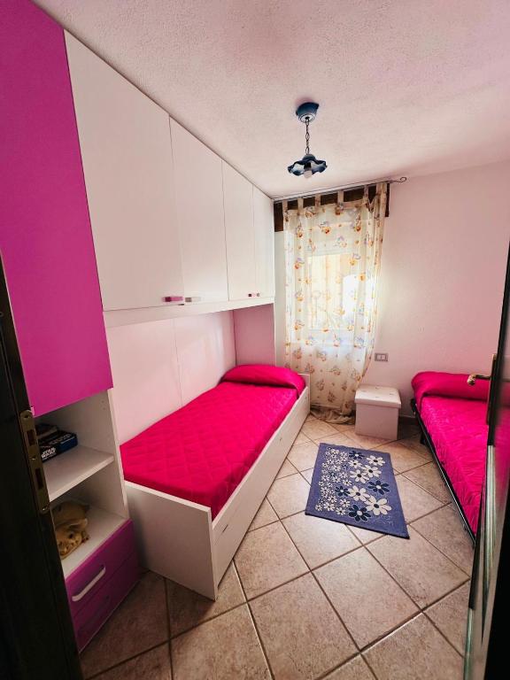 Łóżko lub łóżka w pokoju w obiekcie Appartamento 5 Vista Panoramica