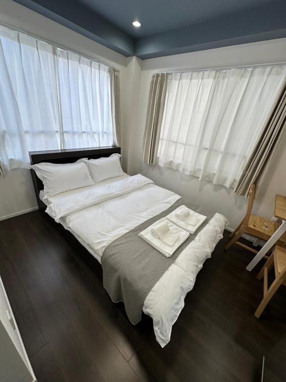 Postel nebo postele na pokoji v ubytování 福ホテル402