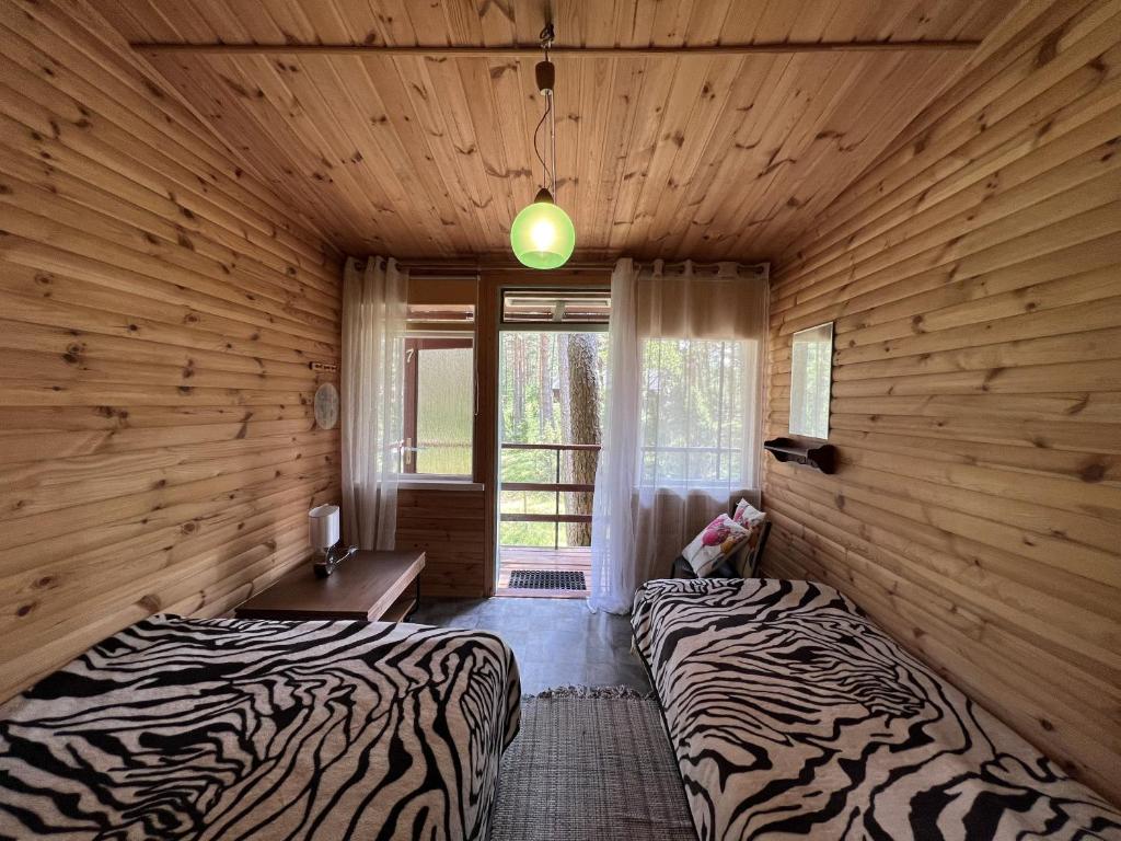 Postel nebo postele na pokoji v ubytování Vesiroos Villa