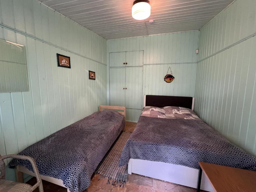 Postel nebo postele na pokoji v ubytování Vesiroos Villa