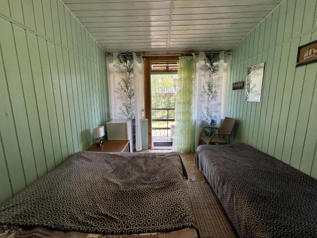 Postel nebo postele na pokoji v ubytování Vesiroos Villa