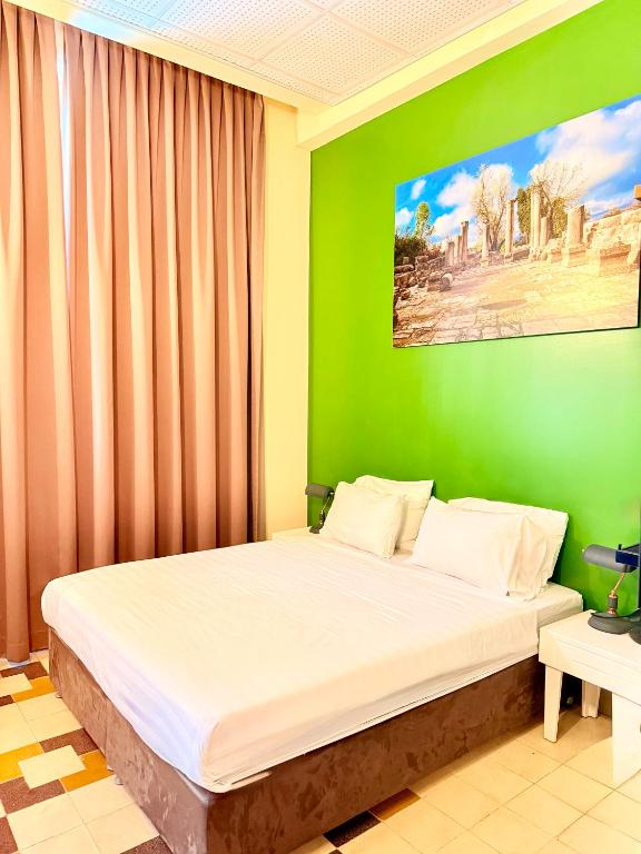 Postel nebo postele na pokoji v ubytování INTA Hotel