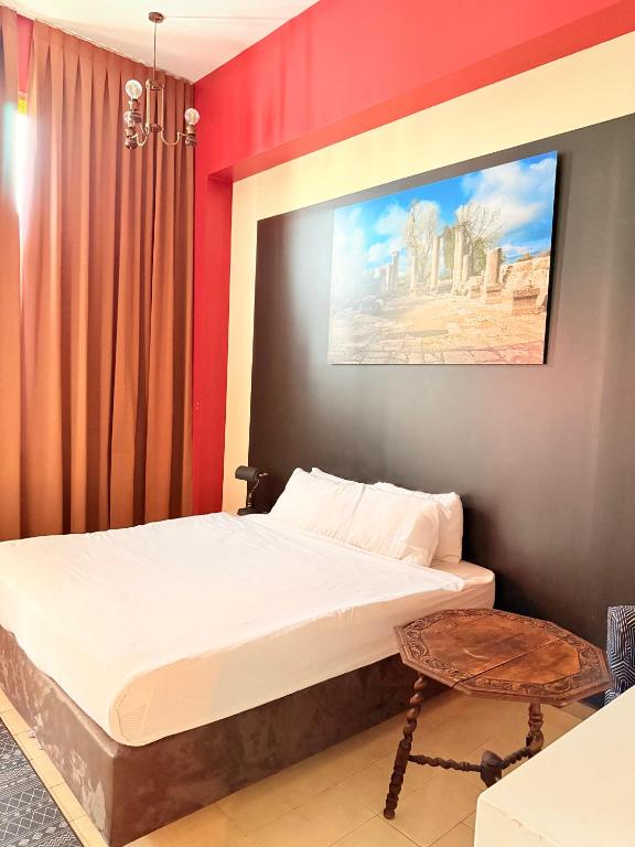 Postel nebo postele na pokoji v ubytování INTA Hotel