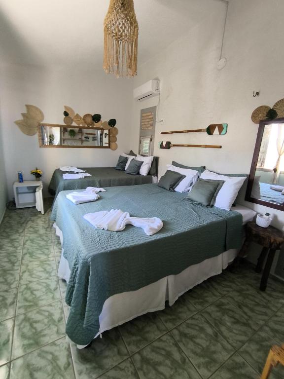 Postel nebo postele na pokoji v ubytování Hospedaria Mandacaru