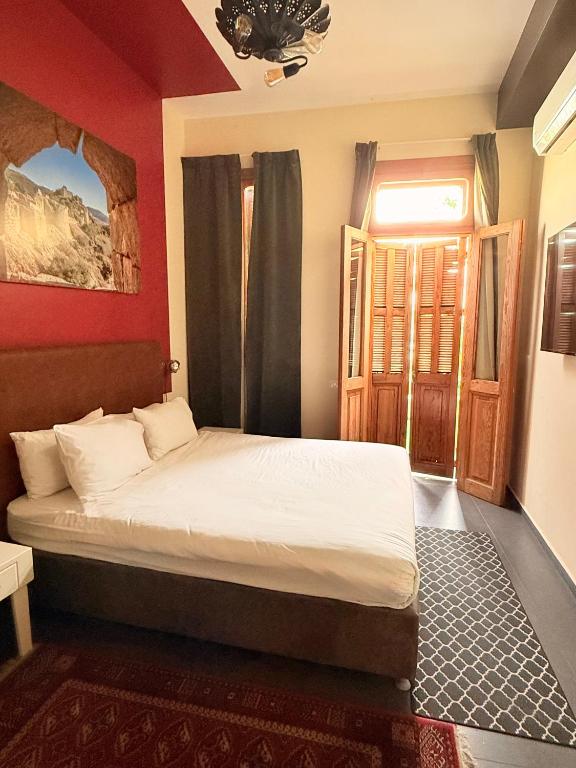 Postel nebo postele na pokoji v ubytování INTA Hotel