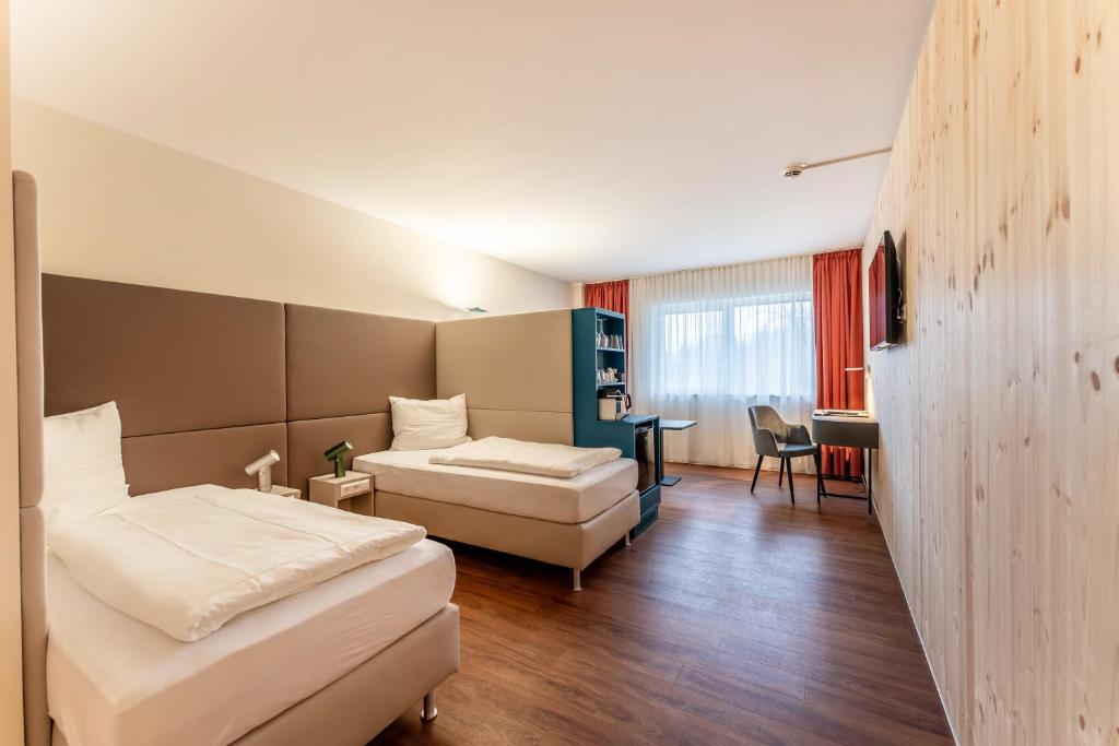 Katil atau katil-katil dalam bilik di Apartments Kehl - Boardinghouse und Ferienwohnungen in Sundheim