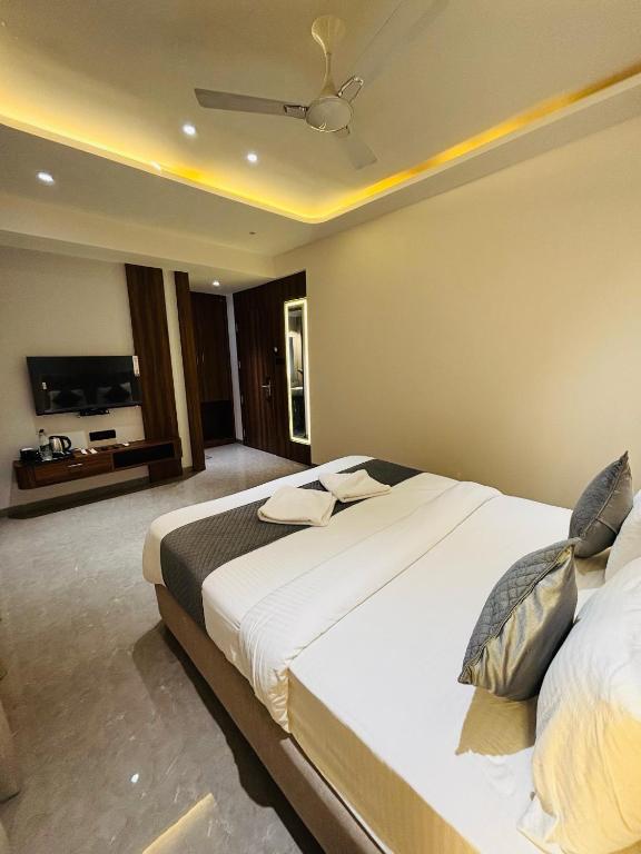 Postel nebo postele na pokoji v ubytování Hotel Royal Retreat