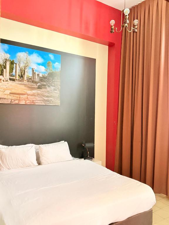 Postel nebo postele na pokoji v ubytování INTA Hotel