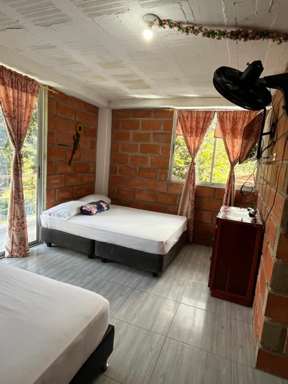 Postel nebo postele na pokoji v ubytování La Clarita