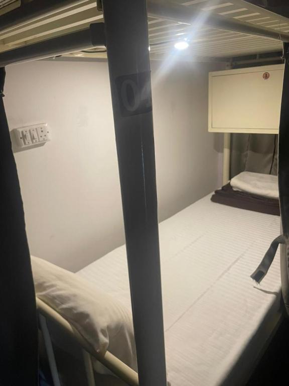 Postel nebo postele na pokoji v ubytování HOTEL DADOs INN