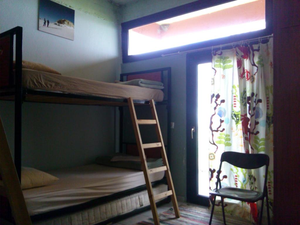 Postel nebo postele na pokoji v ubytování Summit Zero Hostel