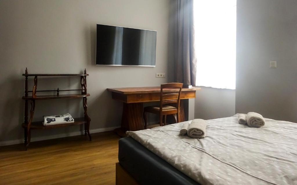 Postel nebo postele na pokoji v ubytování Corvin Point Rooms and Apartments