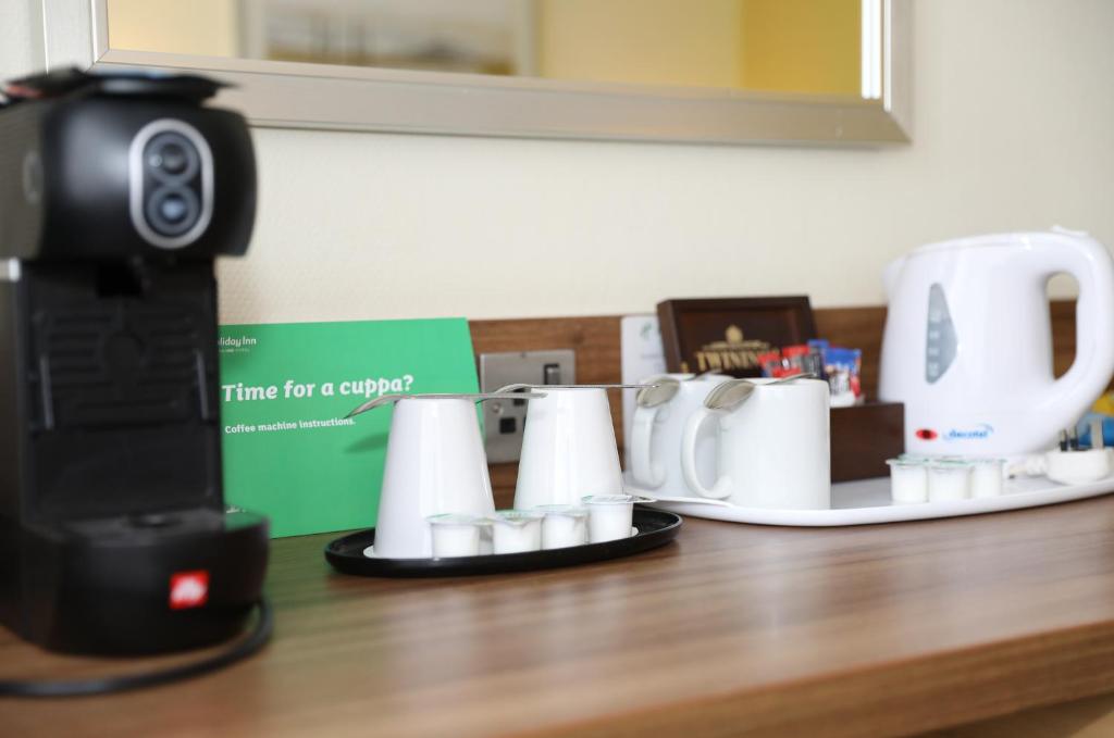 a camera sitting on top of a counter with cups at Holiday Inn Brighton Seafront by IHG in Brighton & Hove