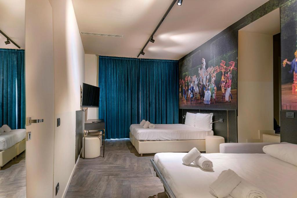 Postel nebo postele na pokoji v ubytování Italianflat - Theatrum Rooms and Suite
