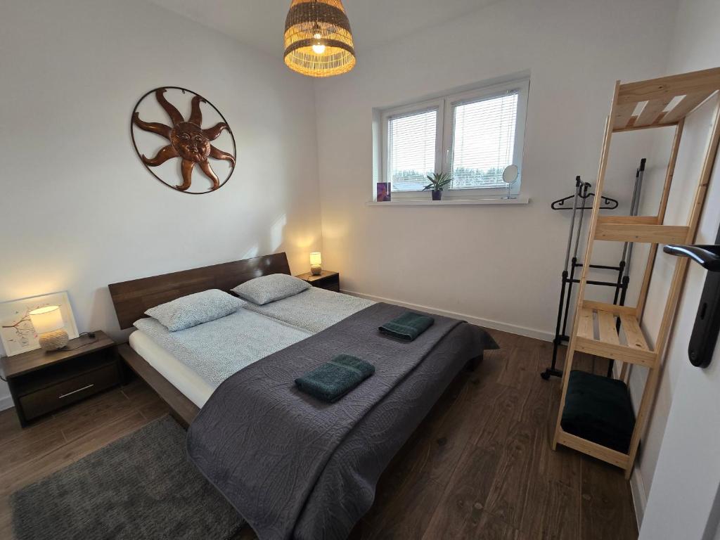 Postel nebo postele na pokoji v ubytování Apartament Danuta Mrągowo