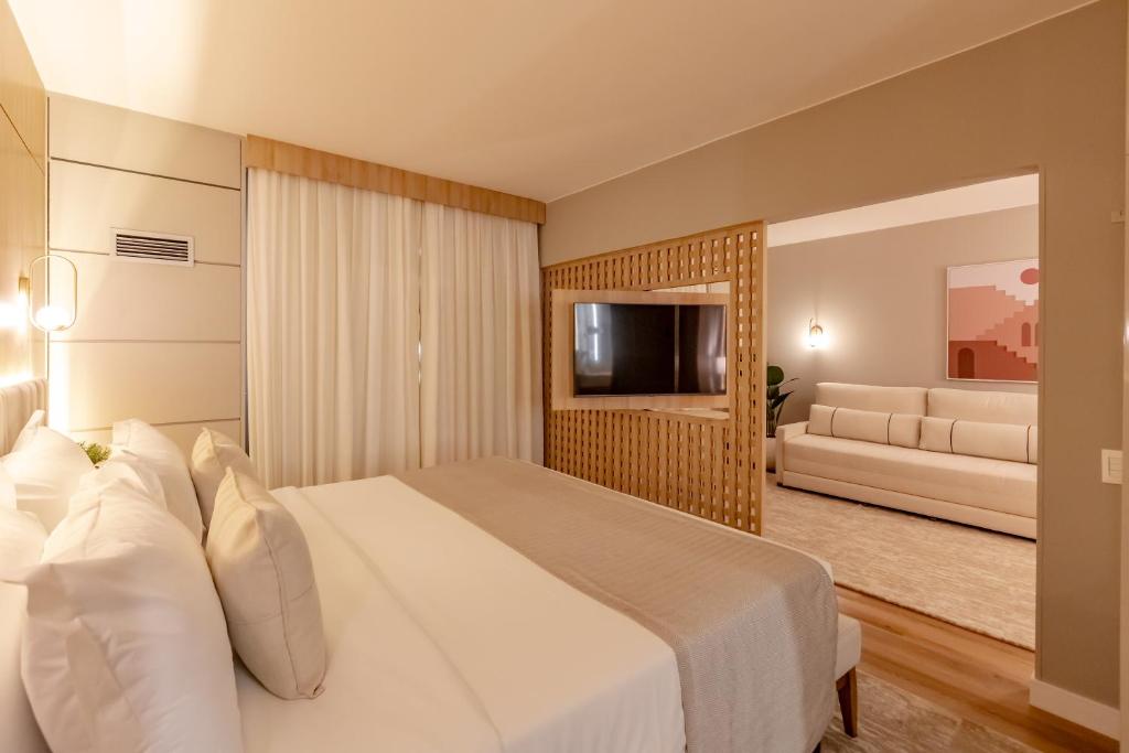 Cama ou camas em um quarto em Mercure Camboriu