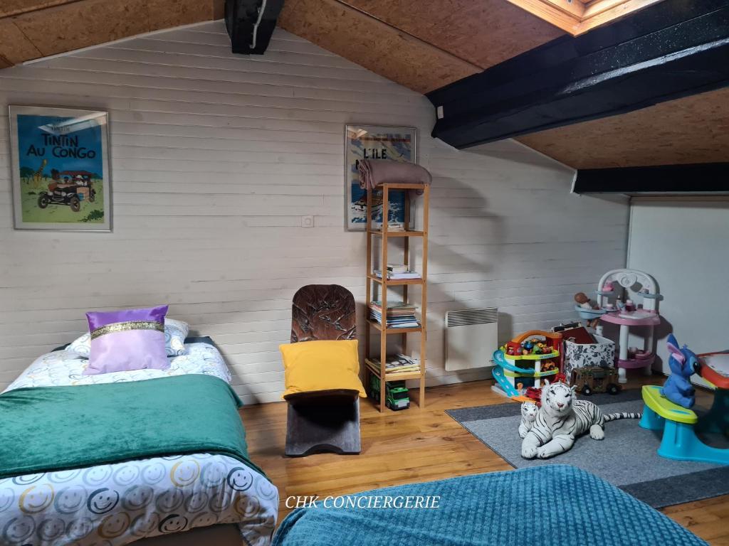 Letto o letti in una camera di L'Udon-Thani gîte de groupe à 4 min du Puy du Fou