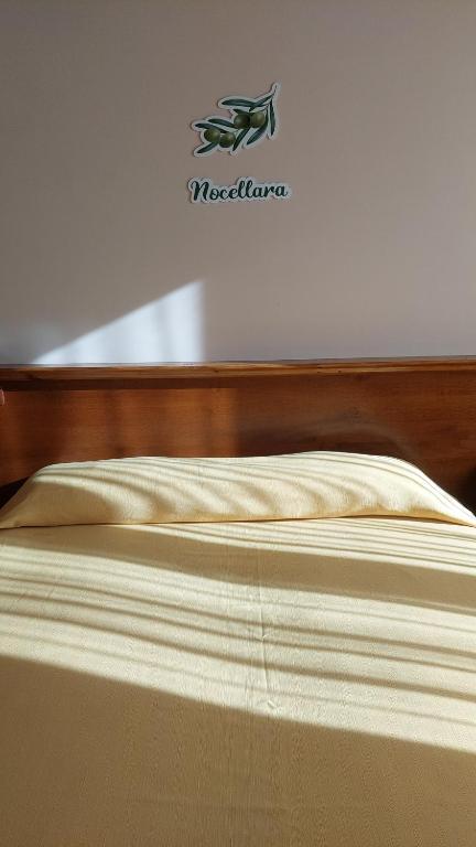 A bed or beds in a room at Uliveto Garden