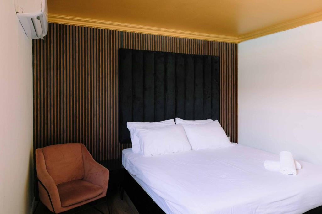 Postel nebo postele na pokoji v ubytování Rich Boutique Hotel