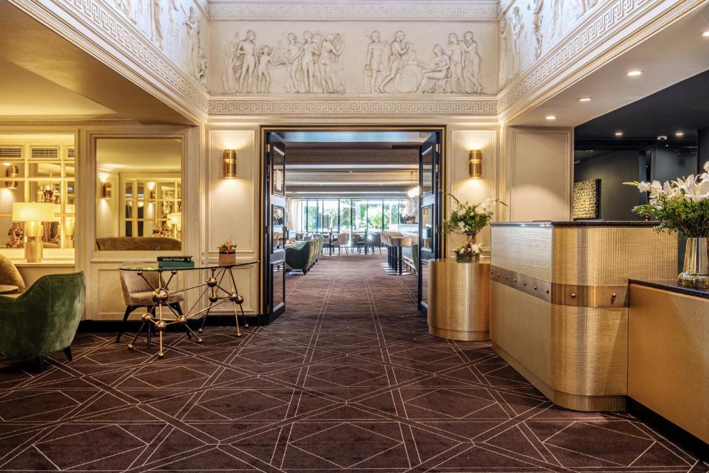 a lobby of a hotel with a hallway at Hotel Barsey by Warwick in Brussels