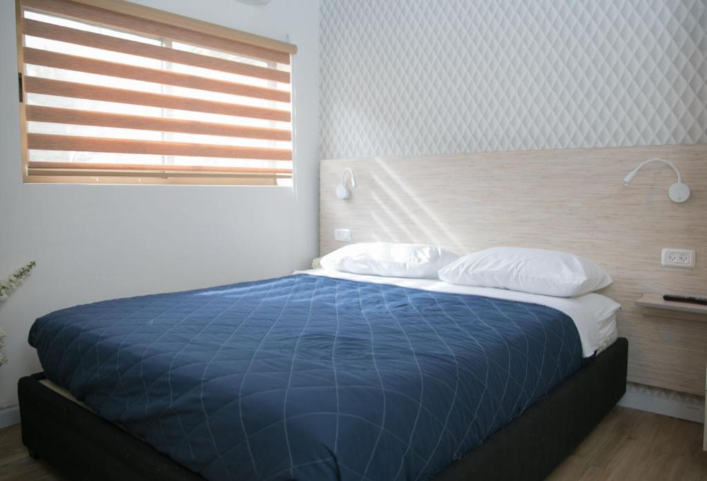 Postel nebo postele na pokoji v ubytování Rich Boutique Hotel