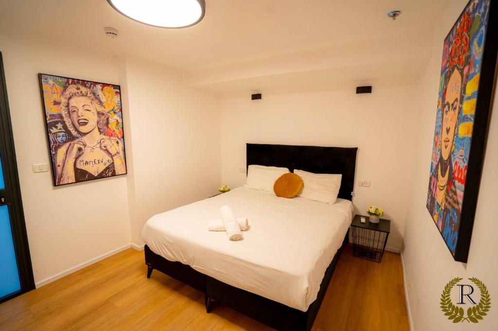 Postel nebo postele na pokoji v ubytování Rich Boutique Hotel