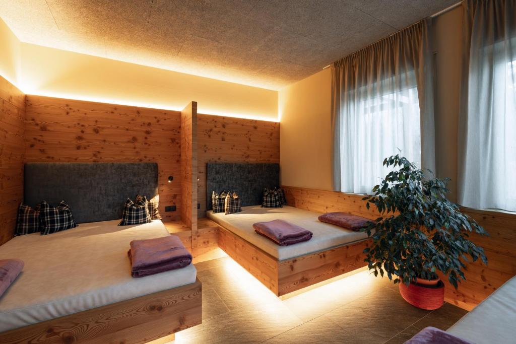 Postel nebo postele na pokoji v ubytování Residence Erika - Apartments, Breakfast & Sauna