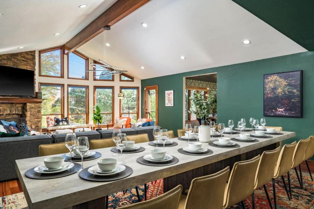 a large dining room with a long table and chairs at The Luxe Retreat With A Pool And A Game Room in Arvada