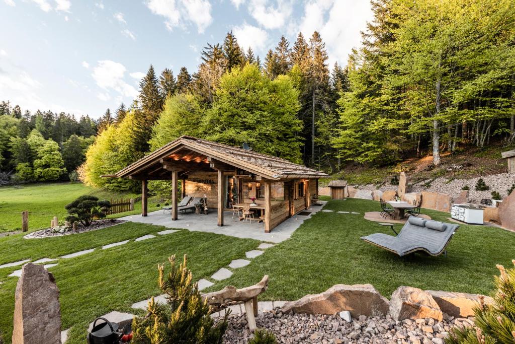 a gazebo in the middle of a yard at La Mendola Alm-Chalet in Mendola