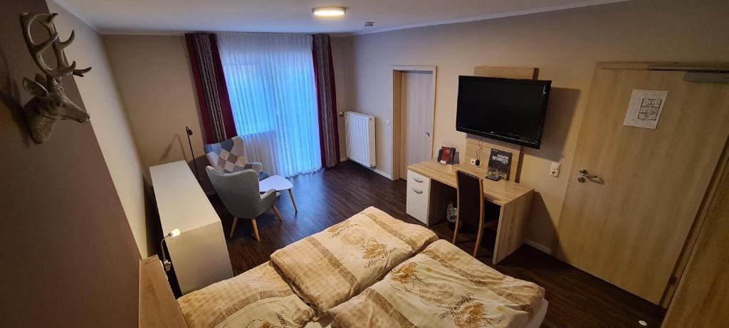 TV a/nebo společenská místnost v ubytování Pension Schenks Landgasthof